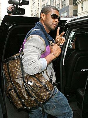 usher-with-louis-vuitton-carry-all.jpg